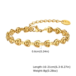Detailed view of golden heart chain bracelet with K18 engraved tag and lobster clasp closure