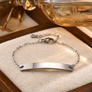 Minimalist gold-plated stainless steel curved bar bracelet with delicate cable chain