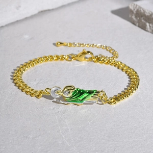 Gold Cuban link bracelet featuring a detailed Saint Jude pendant with green enamel finish