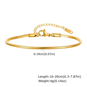 Detail of gold snake chain bracelet showing lobster clasp and k18 hallmark engraving