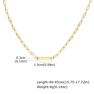 Detail of gold necklace pendant with dimensions 0.3x1.5cm and chain length 40-45cm
