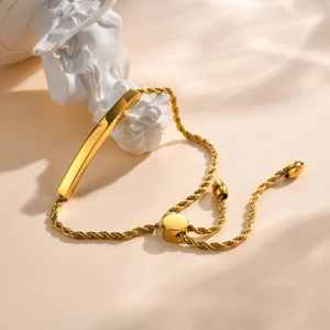 Bracelet ajustable en acier inoxydable doré avec barre incurvée et maille torsadée