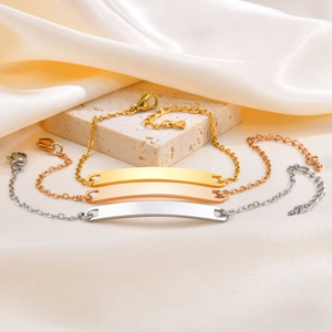 Set of minimalist stainless steel curved bar bracelets in gold, silver, and rose gold