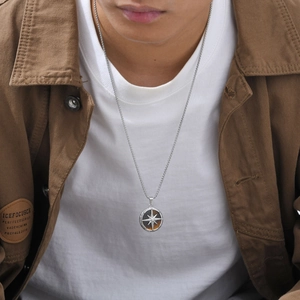 Close-up of men's octagram tiger eye stone necklace on model with stainless steel chain