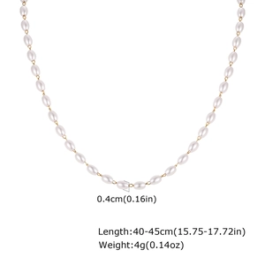 Detail of white oval pearls on a gold stainless steel chain with size measurements