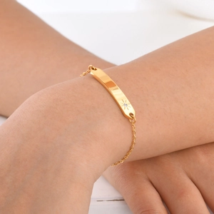 Women's 18K gold plated stainless steel bracelet with starburst engraving and zircon