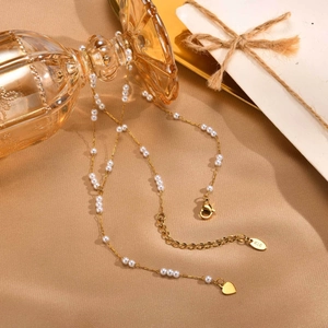 Elegant gold Y-shaped stainless steel necklace with white pearls and heart charm