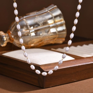 Minimalist gold stainless steel necklace with elegant white oval pearls for women