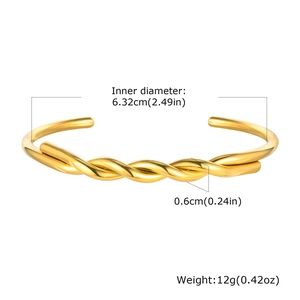 Detail showing dimensions of the gold twisted stainless steel cuff bangle and weight info