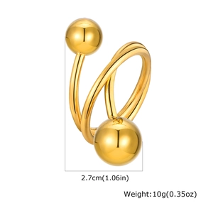 Detail view of golden triple-layered crossover ring with smooth polished metal spheres