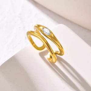 Detailed macro view of a gold double-layer ring with marquise-cut zircon stone inlay