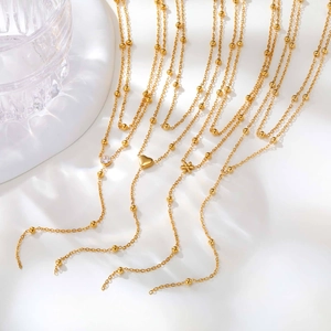 Collier Y double épaisseur en acier inoxydable doré avec perles et pendentifs cœur fleur