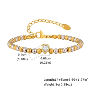 Tweekleurige goud en zilveren kralenarmband met een sprankelende hart-zirkonia
