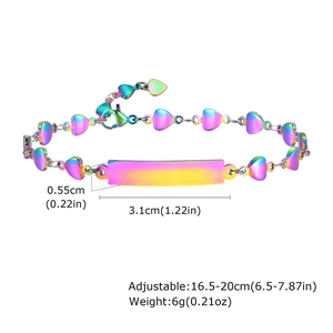Macro detail of adjustable rainbow stainless steel heart chain bracelet with ID tag