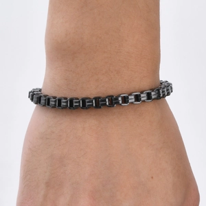 Men's black stainless steel chain bracelet with square links shown on a wrist