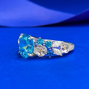 Luxurious S925 silver ring featuring a 2-carat oval blue zircon with floral carvings
