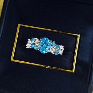 Elegant S925 silver flower ring featuring a 2-carat oval blue sapphire stone
