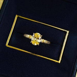 Vintage 925 silver gold-plated ring with oval yellow gemstone in a luxury jewelry box
