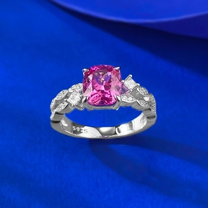 Macro shot of S925 hallmark on silver pink cushion-cut gem ring with leaf band