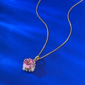 Luxurious S925 silver necklace with pink corundum pendant on blue silk background