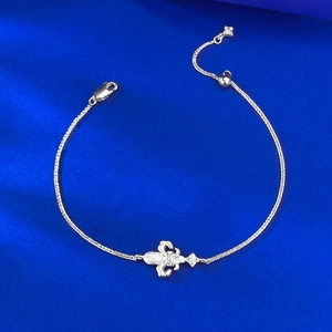 S925 sterling silver fleur-de-lis bracelet with adjustable chain on blue background