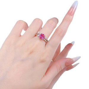 Pink cushion-cut gemstone ring with S925 silver crossover band on model hand