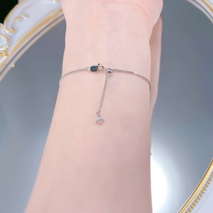 Close-up of S925 silver iris chain bracelet featuring adjustable bead and star charm