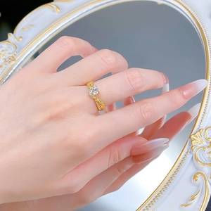 Detail of s925 gold plated wheat ear ring featuring a sparkling round center zircon