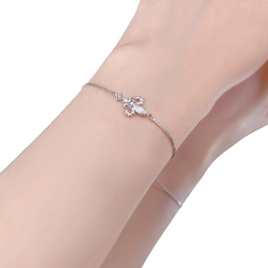 S925 sterling silver chain bracelet with a sparkling crystal insect bee charm on wrist