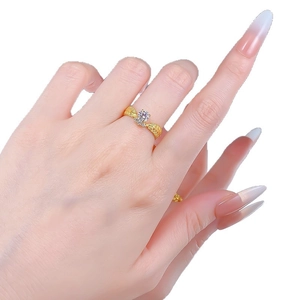 Classic wheat ear engraved ring with brilliant round center stone on model hand