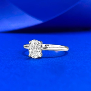 Macro shot of 1 carat oval cut solitaire ring in S925 silver with four-prong setting
