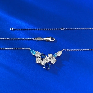 Elegant S925 sterling silver floral necklace featuring cluster of blue and white zirconia