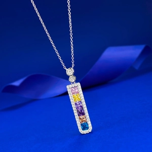 Detailed view of S925 silver necklace featuring a rectangular rainbow gemstone pendant
