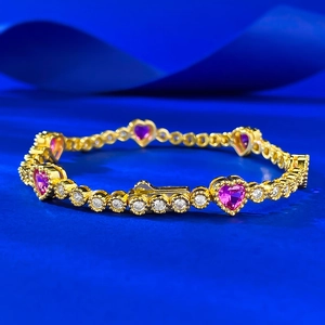 Elegant gold-plated S925 silver bracelet featuring pink heart gems and white diamonds