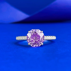 Macro detail of S925 silver ring featuring a large purple millennium cut octagonal stone