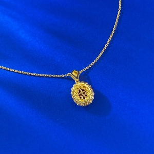 Detailed close-up showing the hollow-out craft on the back of this gold oval pendant