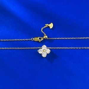 Exquisite S925 sterling silver gold clover pendant necklace on blue silk background