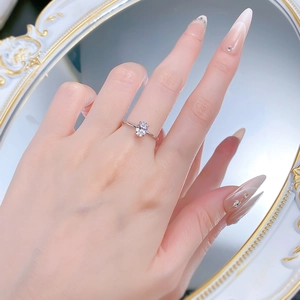 Detail of 1 carat oval solitaire S925 silver ring worn by model in elegant mirror setting