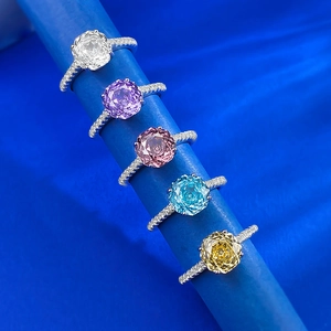 Detailed macro view of five S925 silver rings with colorful rose-cut faceted gemstones