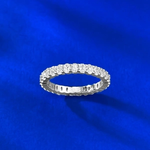 Macro shot of S925 sterling silver band with oval-cut eternity diamonds and S925 hallmark