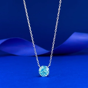 Elegant S925 silver necklace featuring a brilliant round-cut light blue sapphire pendant