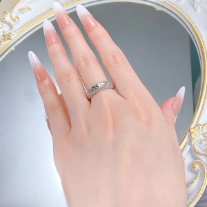 Detail shot of a silver S925 wide band ring featuring triple rows of sparkling cubic zirconia
