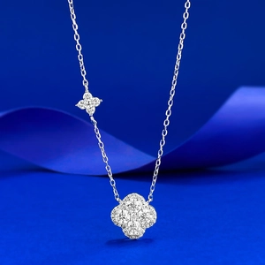 Close-up of S925 silver four-leaf clover pendant necklace with pavé stones