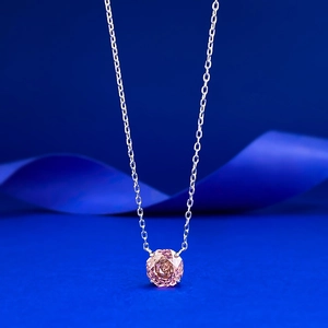 Macro view of a 2.5 carat pink millennium cut stone pendant on an S925 silver chain