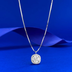Macro shot of S925 silver moissanite pendant with square halo and box chain necklace