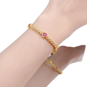 Elegant gold-plated S925 silver bracelet featuring pink heart-shaped stones and zircons