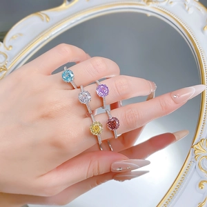 Detail of S925 silver rings with colorful cushion-cut gemstones in a vintage mirror setting