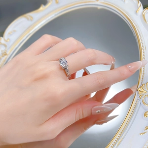 Classic S925 silver ring with large round diamond shown on hand with mirror reflection