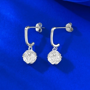 S925 sterling silver drop earrings with octagon cut stones on a royal blue background