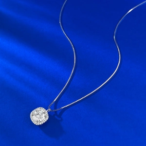 Classic S925 sterling silver necklace with a round moissanite halo pendant on a blue background